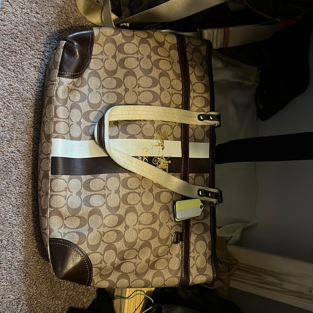 Coach baby bag. Comes with changing pad